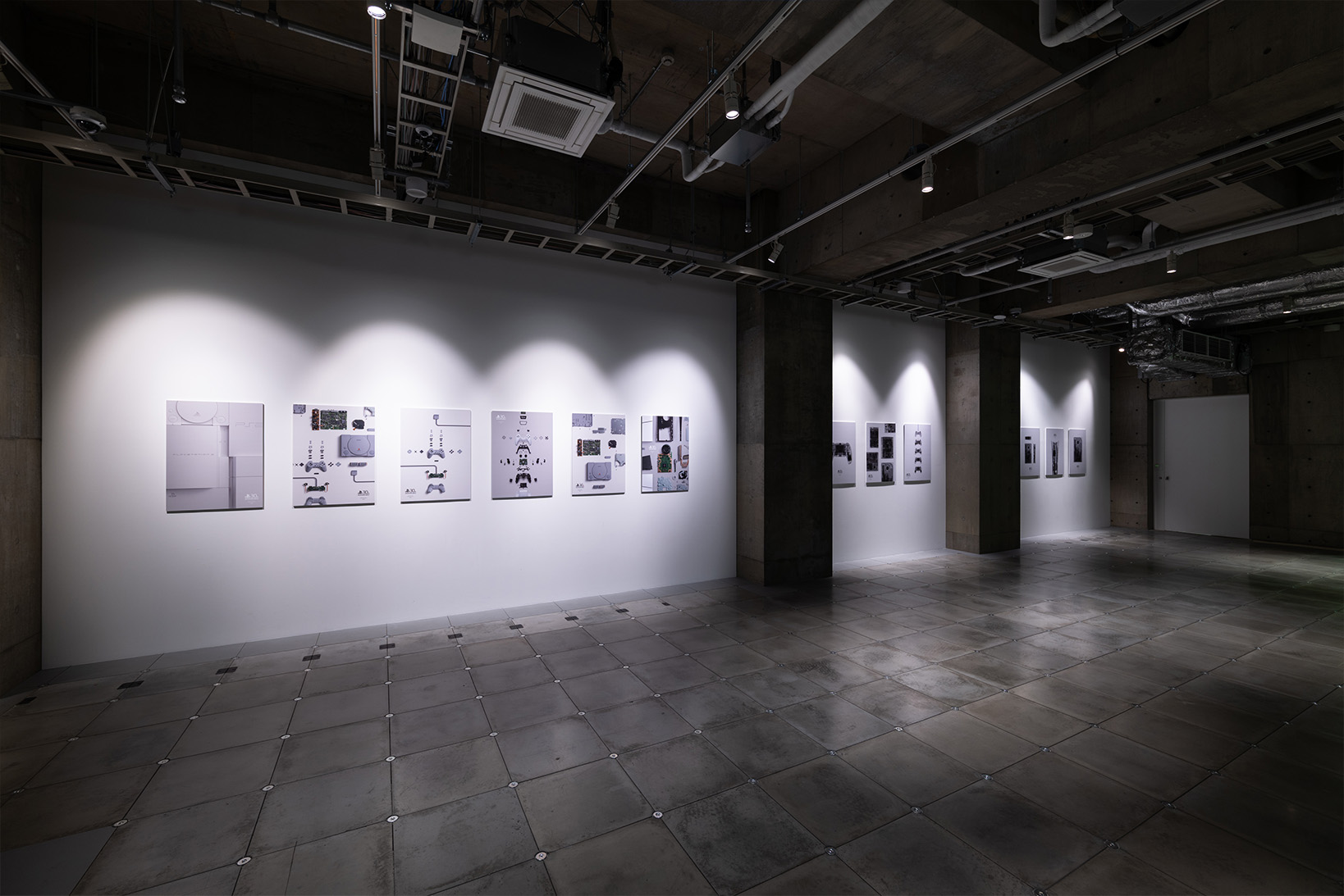 Photo of the 3F poster exhibition, displaying 12 of the 'PlayStation Limited Posters' included in the 'PlayStation 30th Anniversary Collection'.